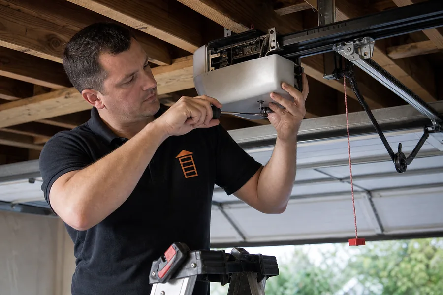Open Now Garage Doors technician repairing a garage door opener in Spokane, WA