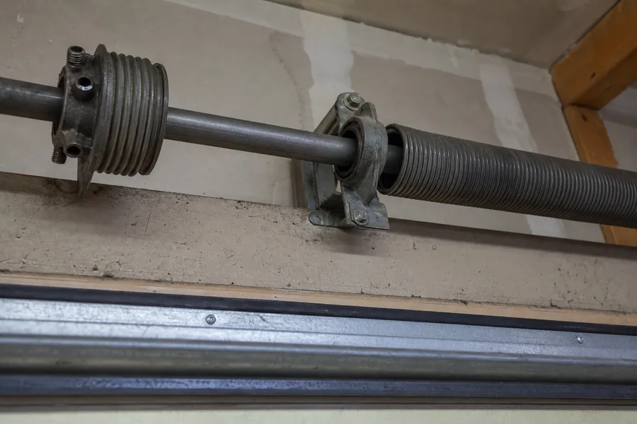 Torsion spring, winding cone and center bearing above a garage door in Spokane, WA
